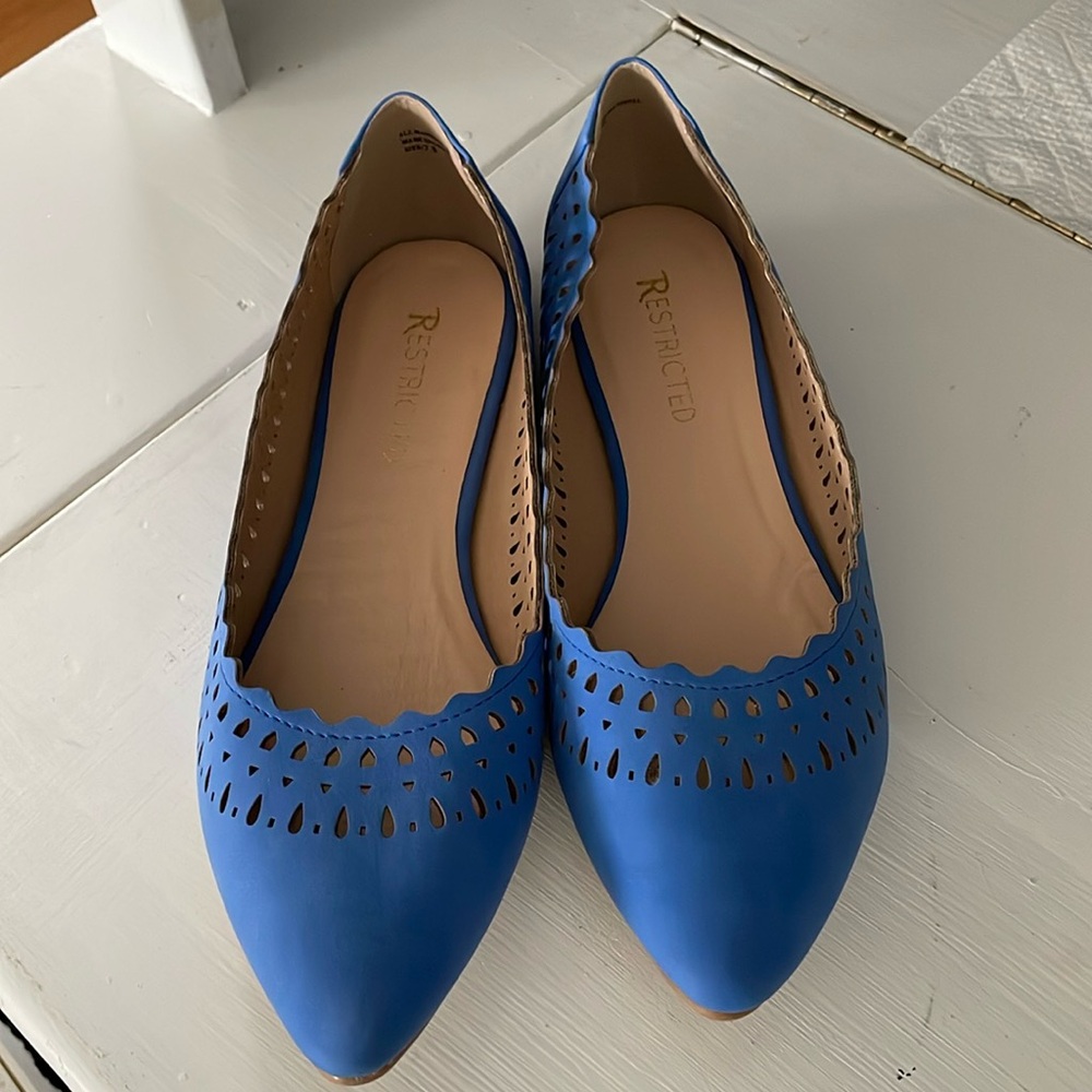 Restricted cornflower blue flats